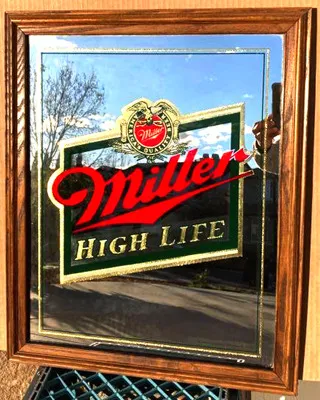 Miller High Life mirror photo taken outdoors