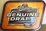 Miller Genuine Draft tin sign with black label